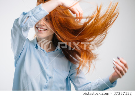 Portrait of beautiful cheerful redhead girl with 37257132