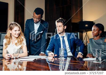 female team leader talking with mixed race group 37257207