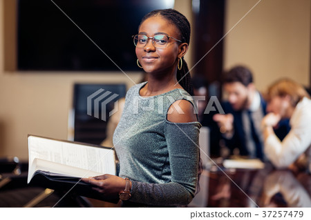 African businesswoman look at camera in boardroom 37257479