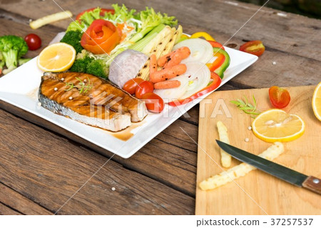 Salmon fillets. Grilled salmon, salmon steak on ol Salmon fillets. Grilled salmon, salmon steak on ol 37257537