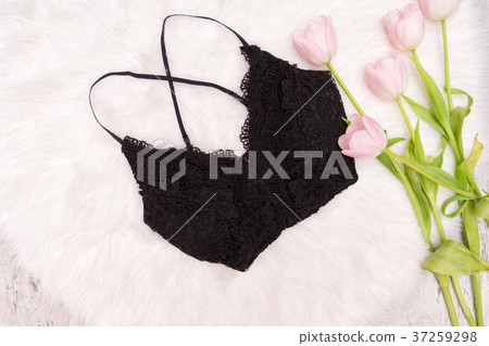 Black lace top on white fur and pink tulips Black lace top on white fur and pink tulips 37259298