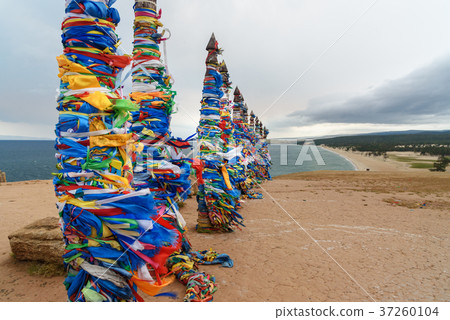 Wooden ritual pillars with colorful ribbons Hadak 37260104