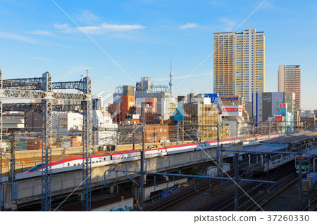 Akita Shinkansen E5 series passing Nishi Nippori Station 37260330