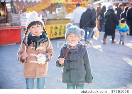 Child eating chocolate banana in the first pot Child eating chocolate banana in the first pot 37261068