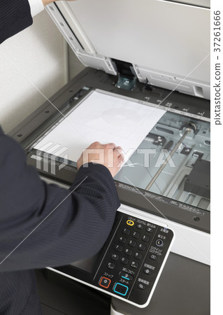 Businessman hand using a copy machine 37261666