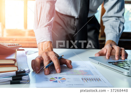 Businessman hand working with finances Businessman hand working with finances 37268448