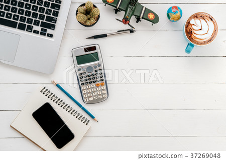 Modern white office desk table with laptop Modern white office desk table with laptop 37269048