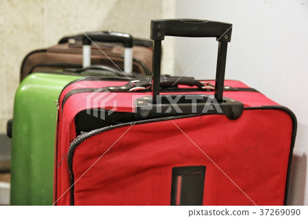 Red broken traveling luggage, crack and torn. 37269090