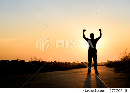 man standing on road at sunset background man standing on road at sunset background 37270846