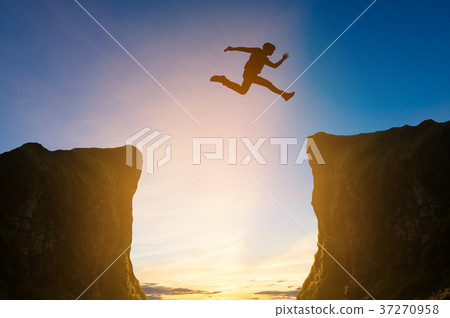man jumping over the cliff, silhouette man jumping over the cliff, silhouette 37270958