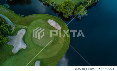 Aerial view of green golf course. 37270993