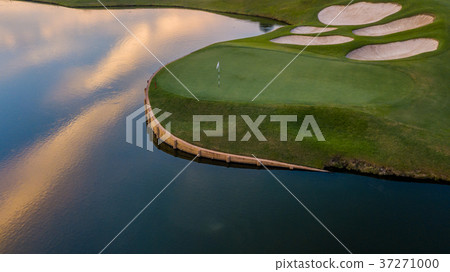 Aerial view of green golf course. 37271000