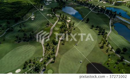 Aerial view of green golf course. 37271002