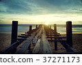 Sunset beach pier with relaxing moment time 37271173