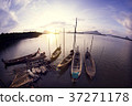 Wooden fishing boats with sunset scenery 37271178