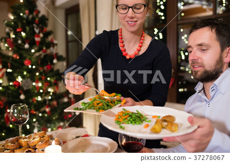 Beautiful couple celebrating Christmas. 37278067