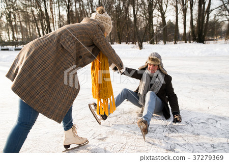 Senior couple in sunny winter nature ice skating. Senior couple in sunny winter nature ice skating. 37279369