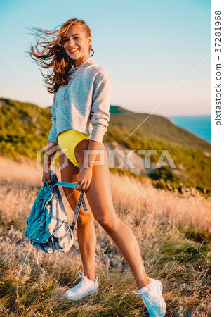 Happy smiled woman outdoor at warm sunset Happy smiled woman outdoor at warm sunset 37281968