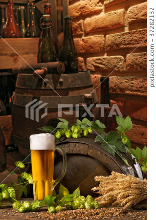 Beer glass with hops and barley in the brewery Beer glass with hops and barley in the brewery 37282132