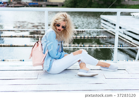 Blonde woman with a bag Blonde woman with a bag 37283120