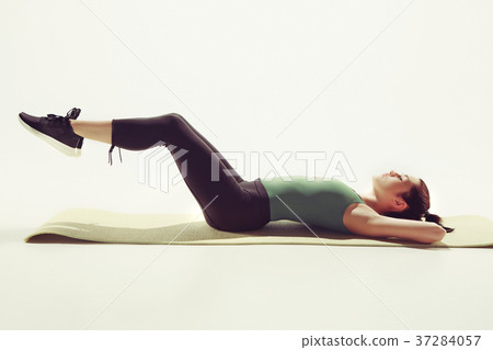 Beautiful slim brunette doing some stretching 37284057