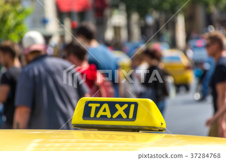 Yellow taxi sign on cab vehicle roof Yellow taxi sign on cab vehicle roof 37284768