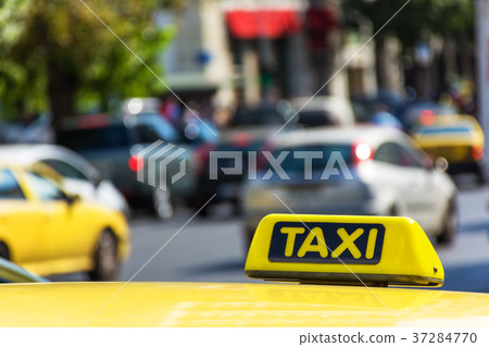 Yellow taxi sign on cab vehicle roof Yellow taxi sign on cab vehicle roof 37284770