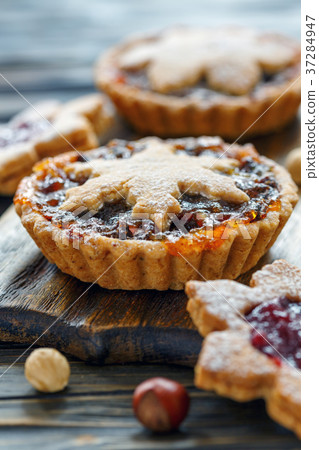 Tartlets with dried fruits, orange jam and nuts. 37284947