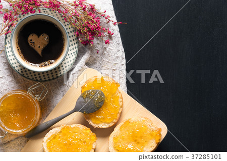 Coffee with heart shape and bread with jam Coffee with heart shape and bread with jam 37285101