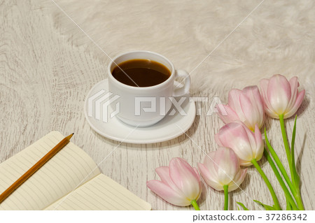 Coffee mug, a notebook with blank pages Coffee mug, a notebook with blank pages 37286342