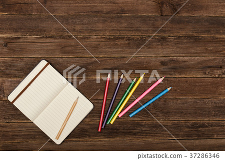 Colored pencils and a notepad Colored pencils and a notepad 37286346
