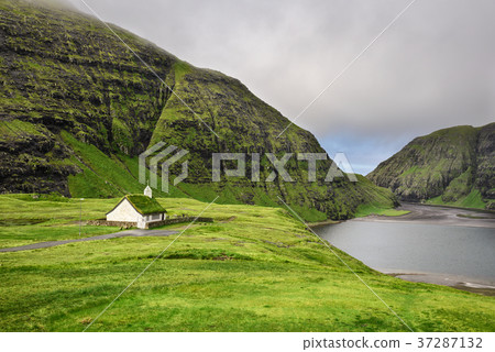 Village church and a lake in Saksun, Faroe Islands Village church and a lake in Saksun, Faroe Islands 37287132