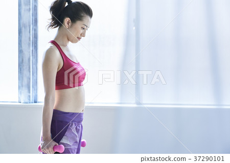 Woman training indoors 37290101
