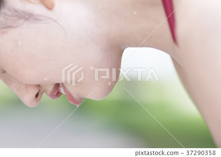 Young woman sweating a lot in training Young woman sweating a lot in training 37290358
