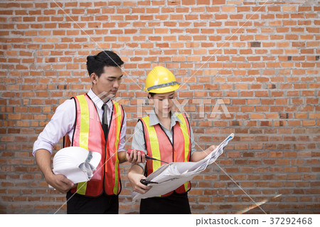 Engineering women and men are working 37292468