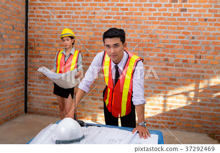 Engineering women and men are working Engineering women and men are working 37292469