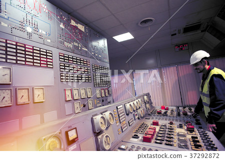 operator holds his hands on the control panel operator holds his hands on the control panel 37292872