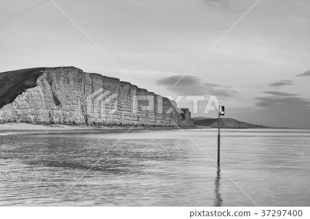 Sunset in West Bay, Dorset, England. 37297400