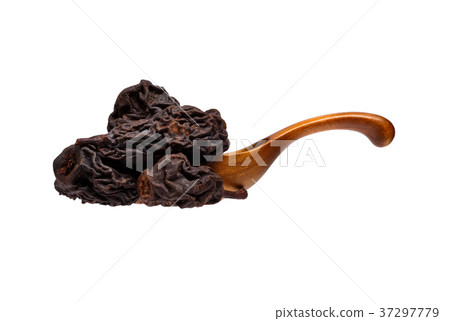 Dried pears in the wooden spoon, isolated on white Dried pears in the wooden spoon, isolated on white 37297779