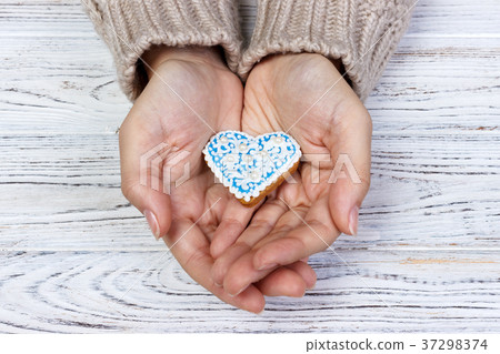 Heart cookies on hand, holiday cookies in hand 37298374