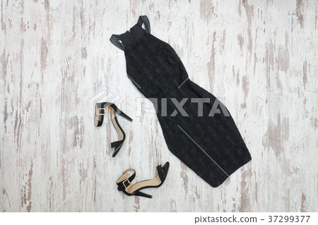 Little black dress and shoes. Wooden background 37299377