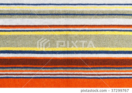Closeup of colored knitted wool texture. Closeup of colored knitted wool texture. 37299767
