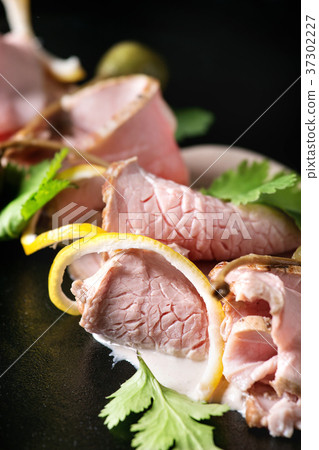 Veal with tuna sauce vitello tonnato 37302227