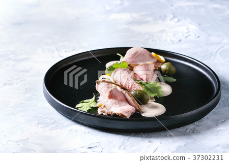 Veal with tuna sauce vitello tonnato 37302231