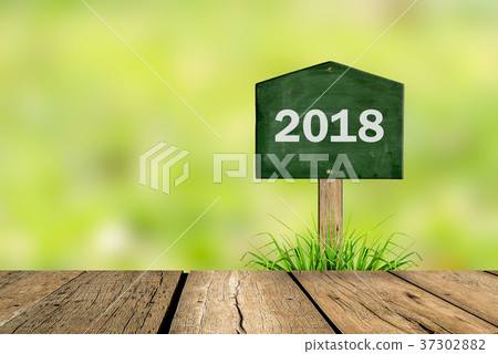 Wooden blackboard sign in grass  37302882