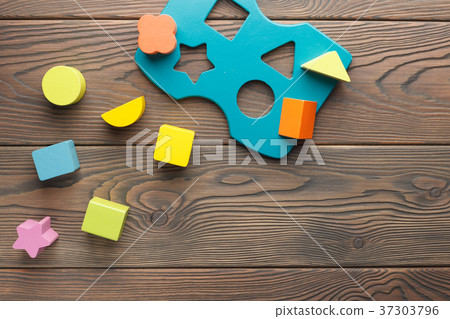 Colorwood blocks for children on wooden background Colorwood blocks for children on wooden background 37303796