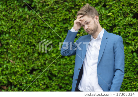 Handsome young man in the park. Handsome young man in the park. 37305334