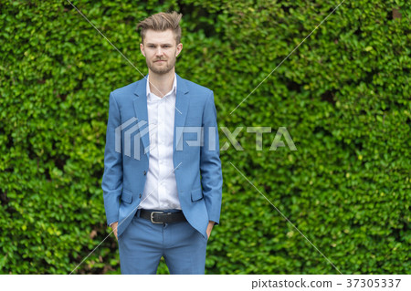 Handsome young man in the park. Handsome young man in the park. 37305337