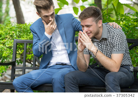 Man consoling sadness friend. Man consoling sadness friend. 37305342