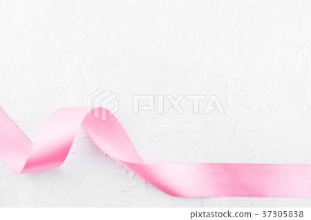 White textured background with pink satin ribbon White textured background with pink satin ribbon 37305838